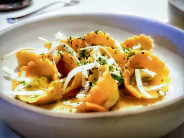 61 Osteria signature dishes Agnolotti del PlinWhole Roasted BranzinoPork Chop Milanese